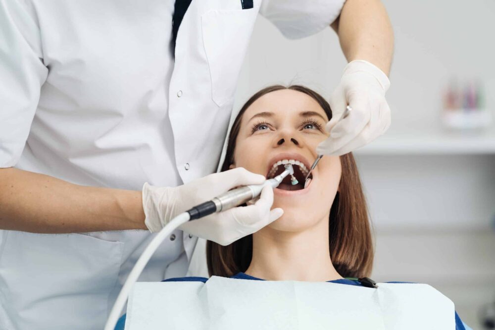 Patient receiving professional dental cleaning in Hobbs, NM