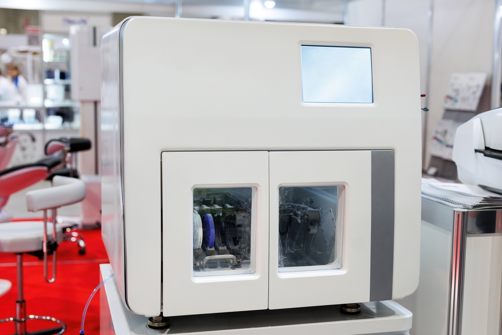 Dental milling machine creating custom crowns with same-day CEREC technology
